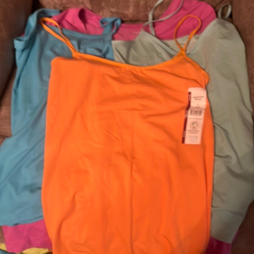 1 Tee-shirt and 3 Tank Tops Size Small (3-5) All are new with tags